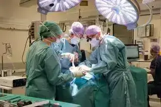 Dr. Pijpe and his team during a surgery with a dental patient
