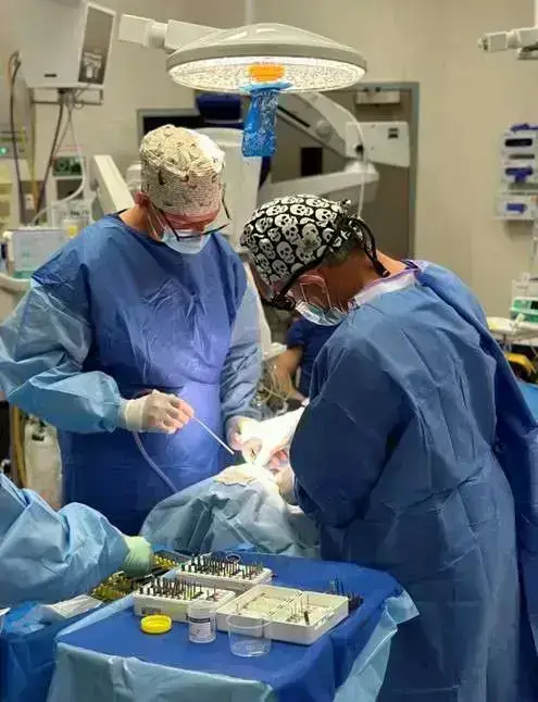Performing surgery on a patient - ZAGA Center Adelaide