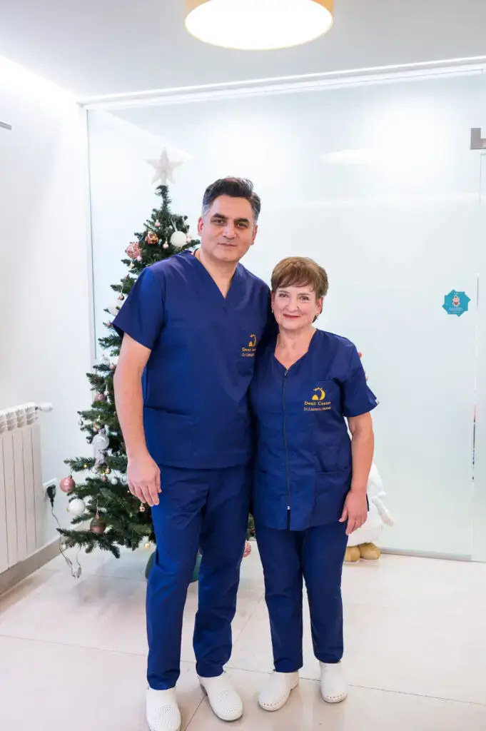Dr. Calinuc, dental implants expert in Iasi, with team